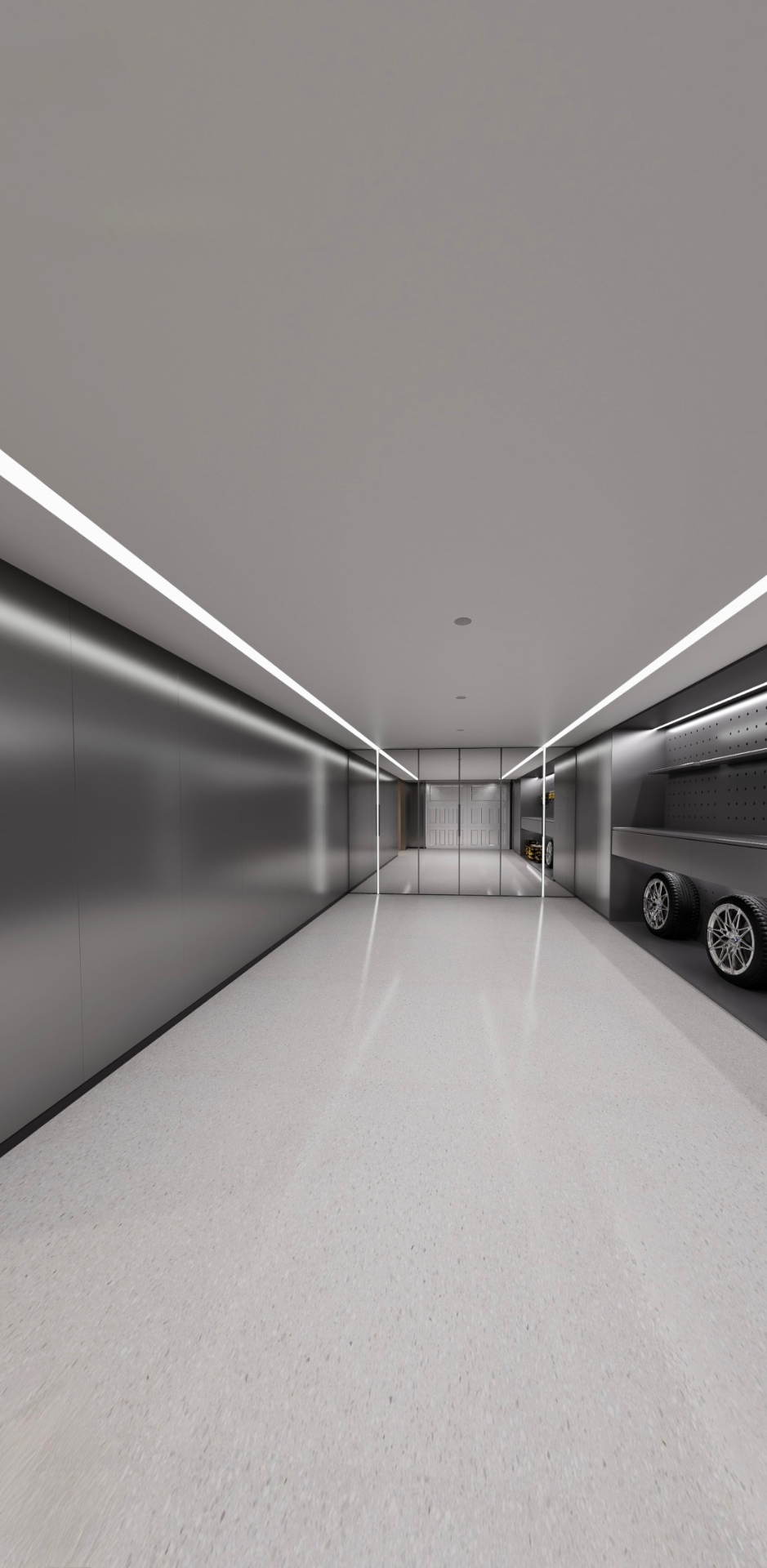Remodeled garage — long view with mirrored wall, LED coves, and polished floor