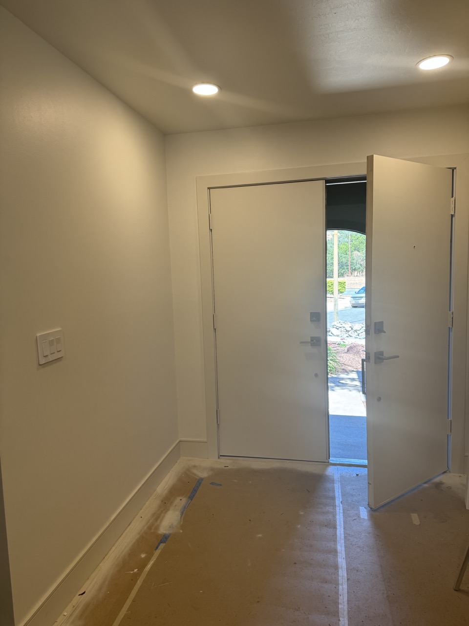 Entryway before remodel — blank white walls